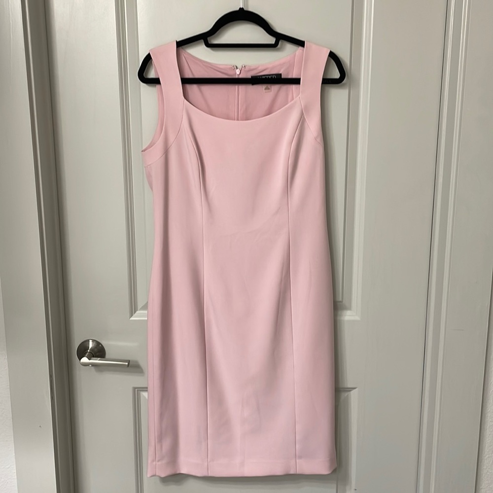 Light pink fitted dress. Size 8. Length is past the knees.